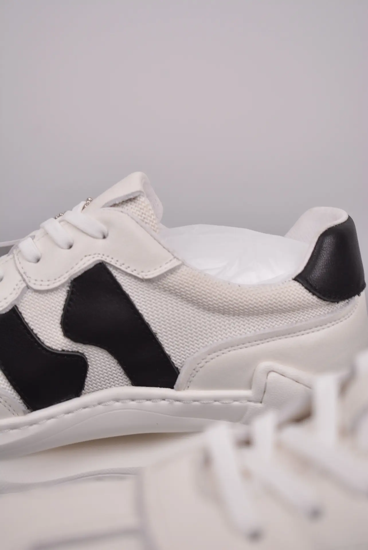 Exploring the Bottega Veneta Speedster Sneakers in Black/Cream: Authentic vs. Replica | YtaYta