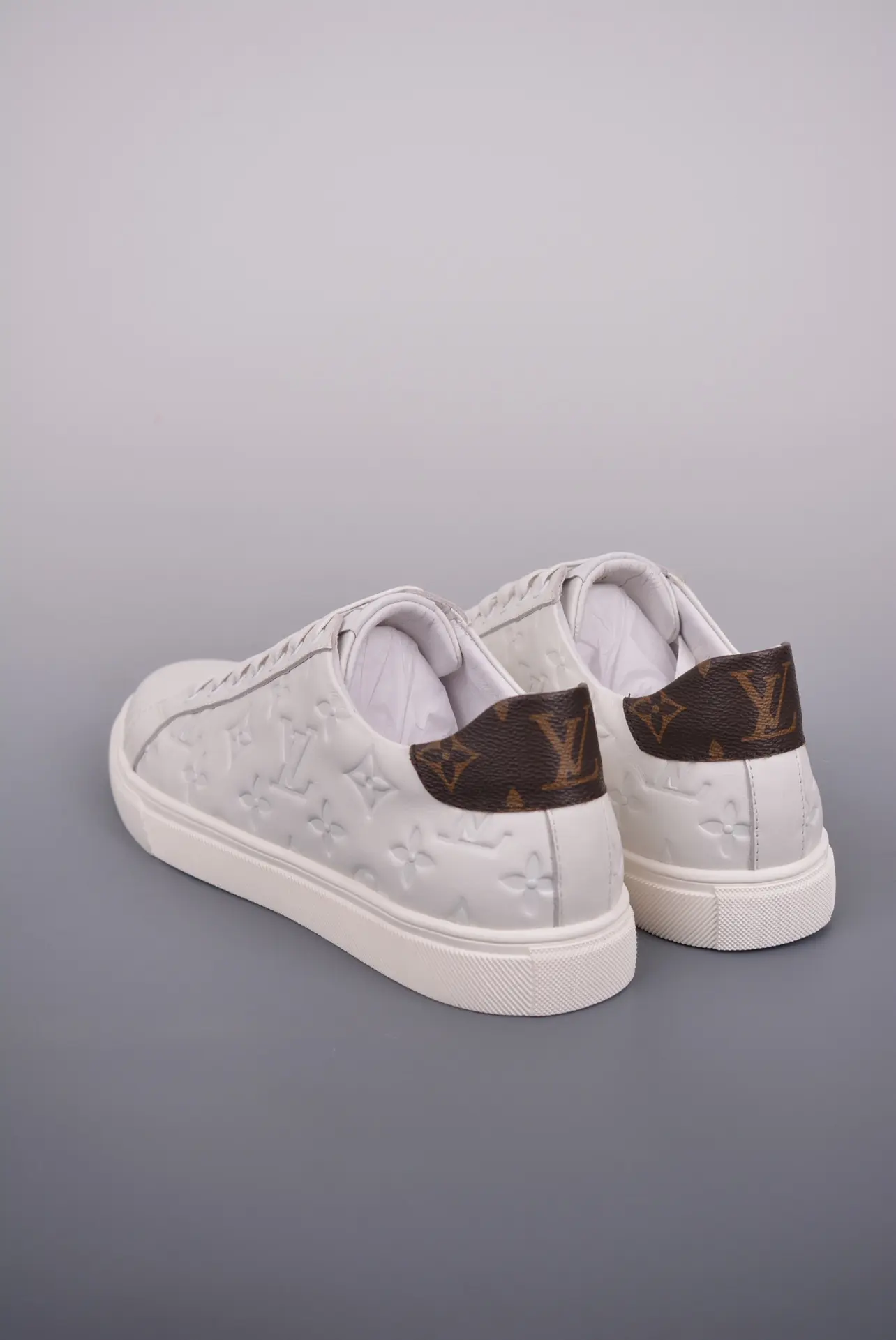 Authentic vs Replica Louis Vuitton Time Out Trainer in White Leather | YtaYta