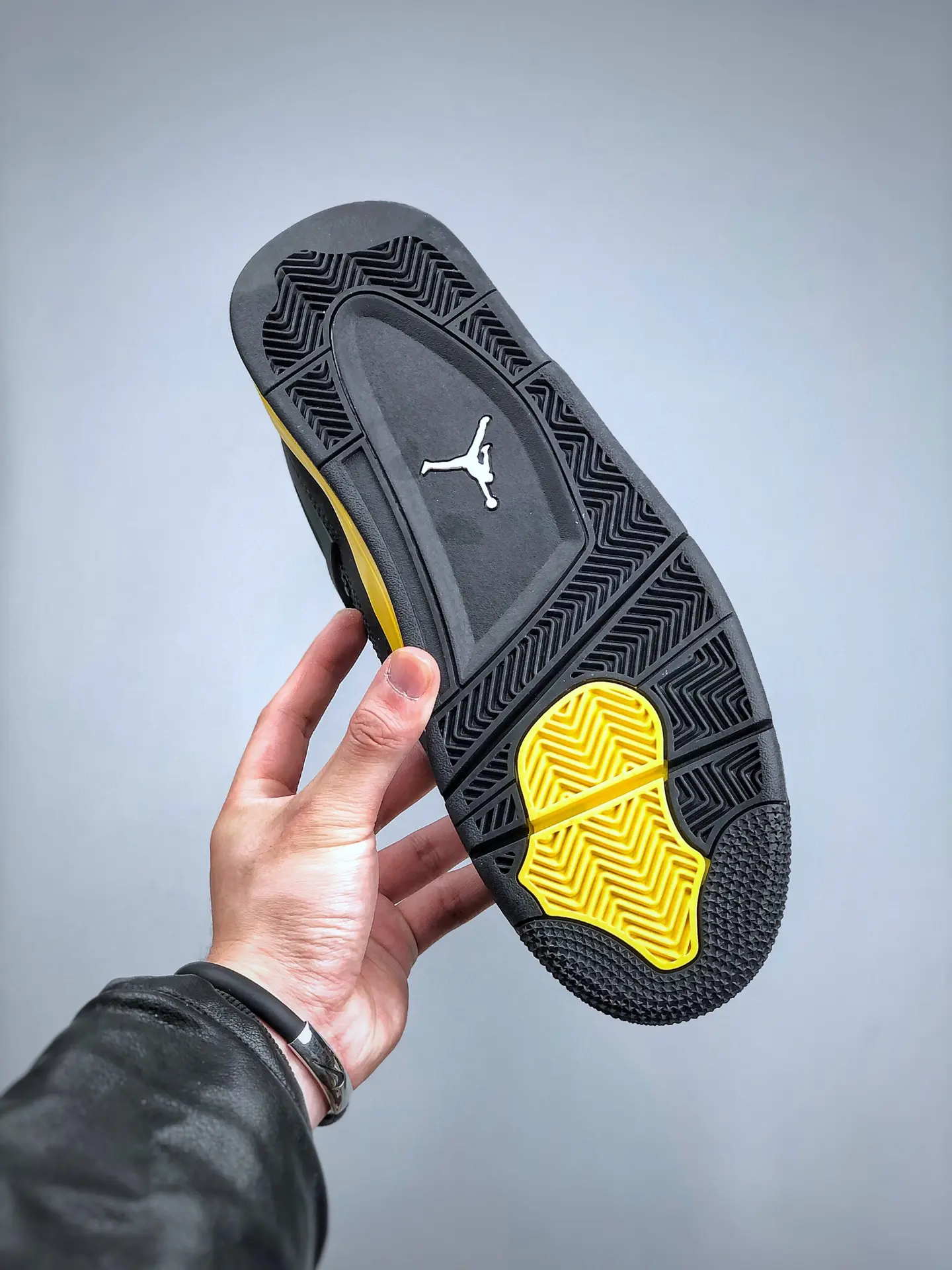 The Intriguing Allure of Air Jordan 4 Retro 'Thunder' Replica in Black and Yellow | YtaYta