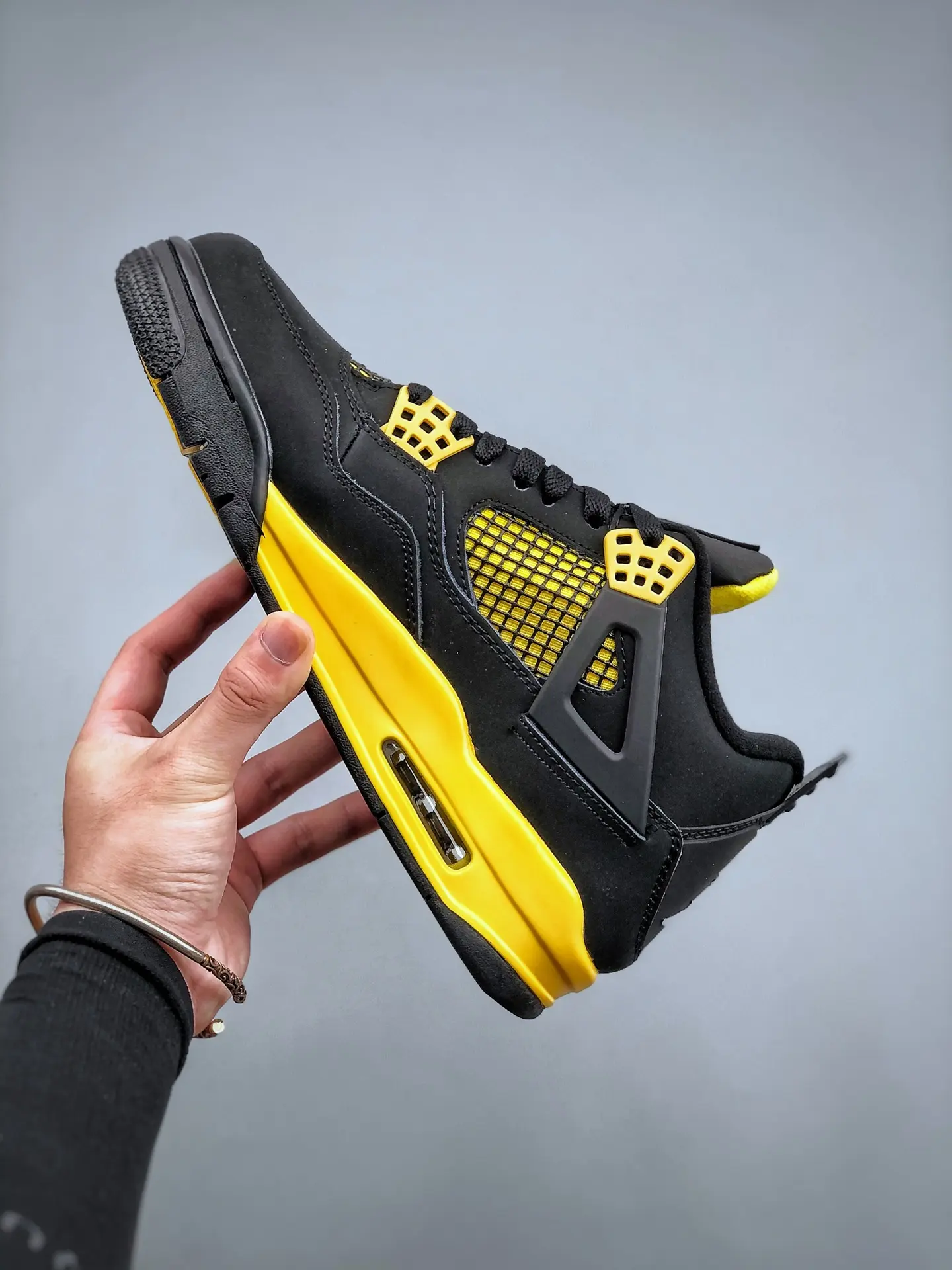 Exploring the Replica Air Jordan 4 Thunder Yellow Black: A Comprehensive Review | YtaYta