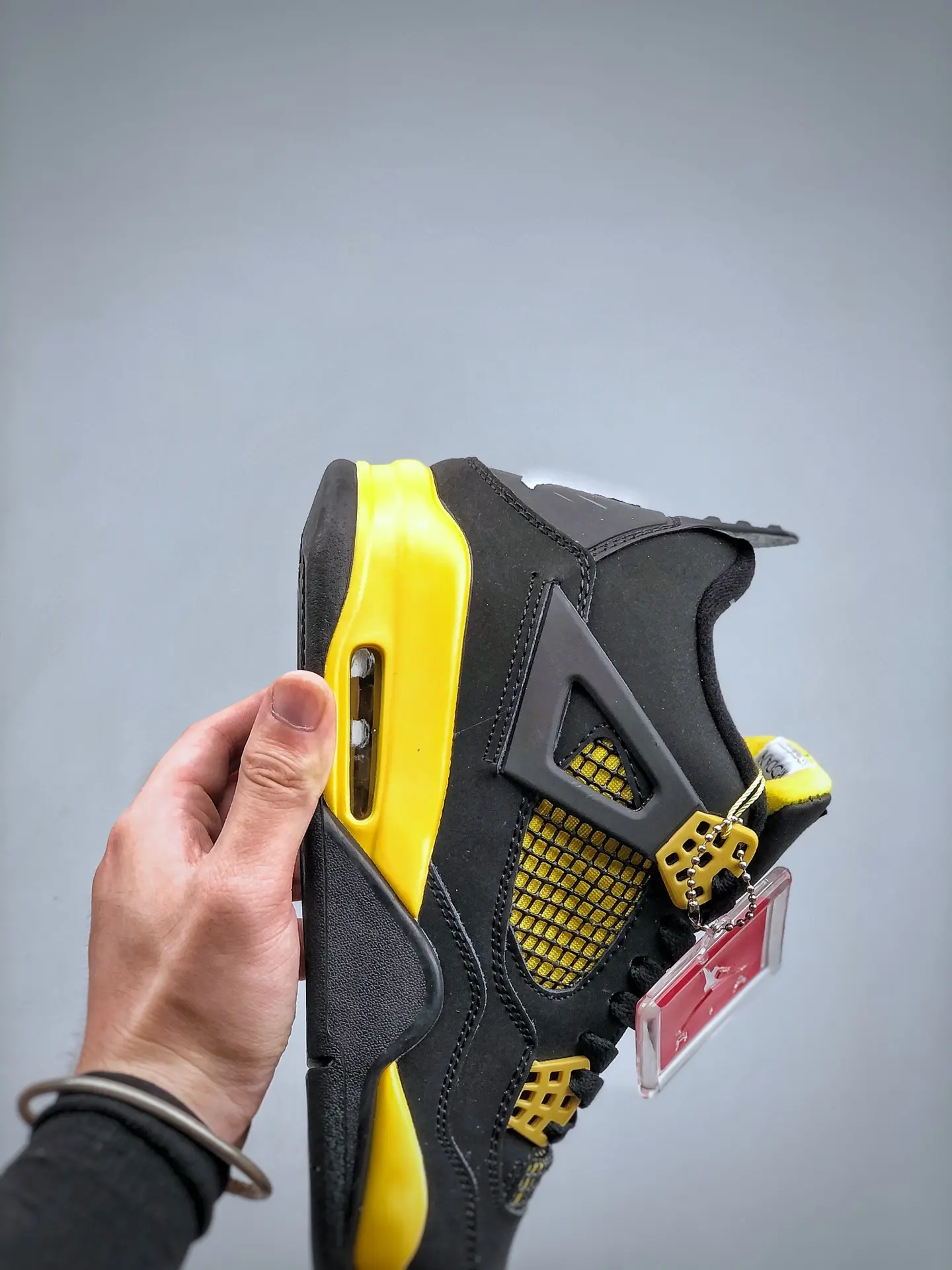 Exploring the Replica Air Jordan 4 Thunder Yellow Black: A Comprehensive Review | YtaYta