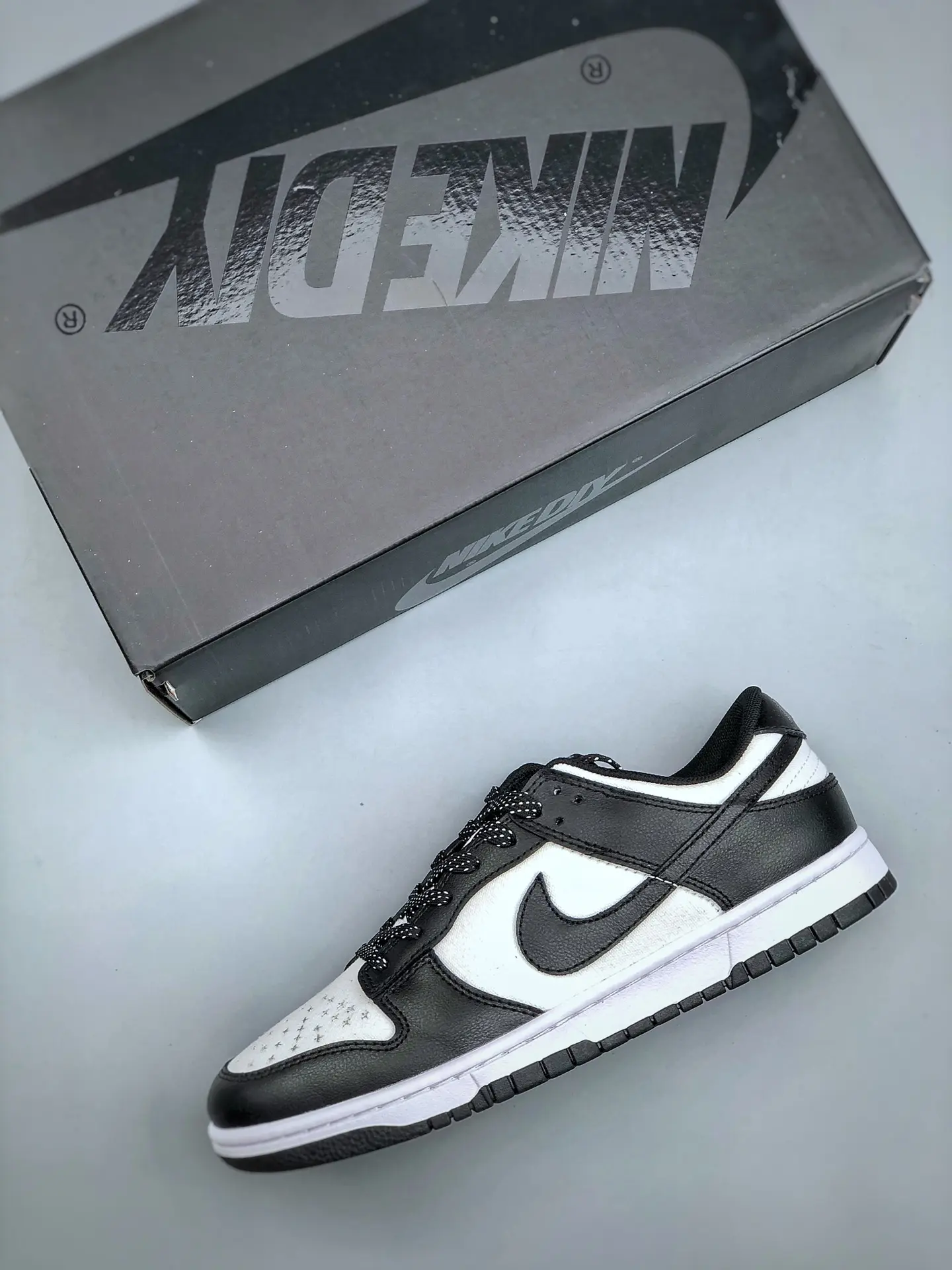 Discover the Allure of Replica Nike Dunk Low Sneakers: Black and White | YtaYta